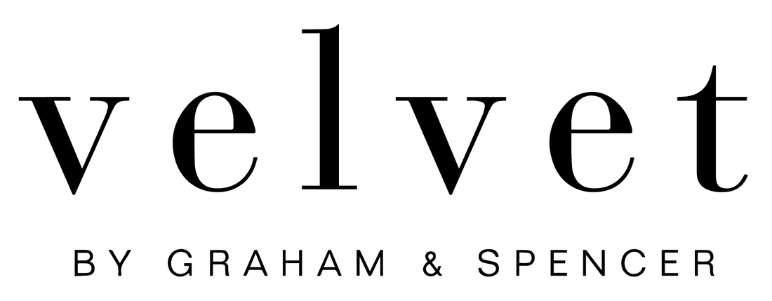 Black serif text reading 'velvet' with smaller text 'BY GRAHAM & SPENCER' underneath on a white background.